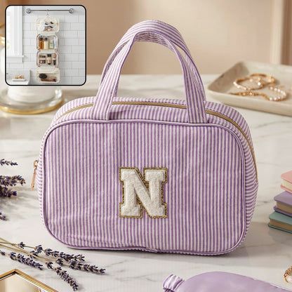 Wukusy travel multi-pocket toiletry bag hanging cosmetic organizer with compartments and zipper closures, shown hanging open.