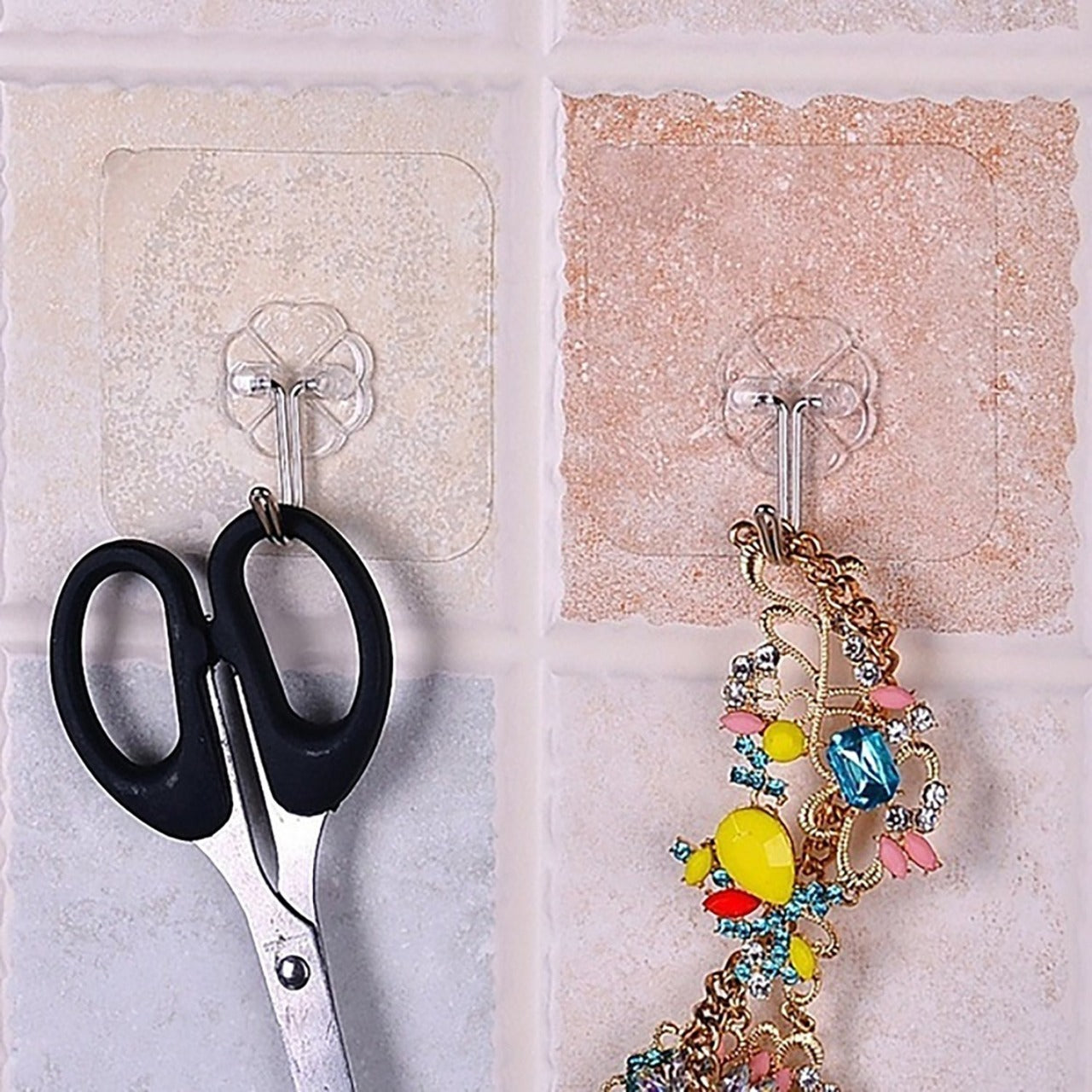 Wukusy 9055 100-piece stainless steel adhesive wall hooks for home improvement, small, strong, and versatile for hanging objects.
