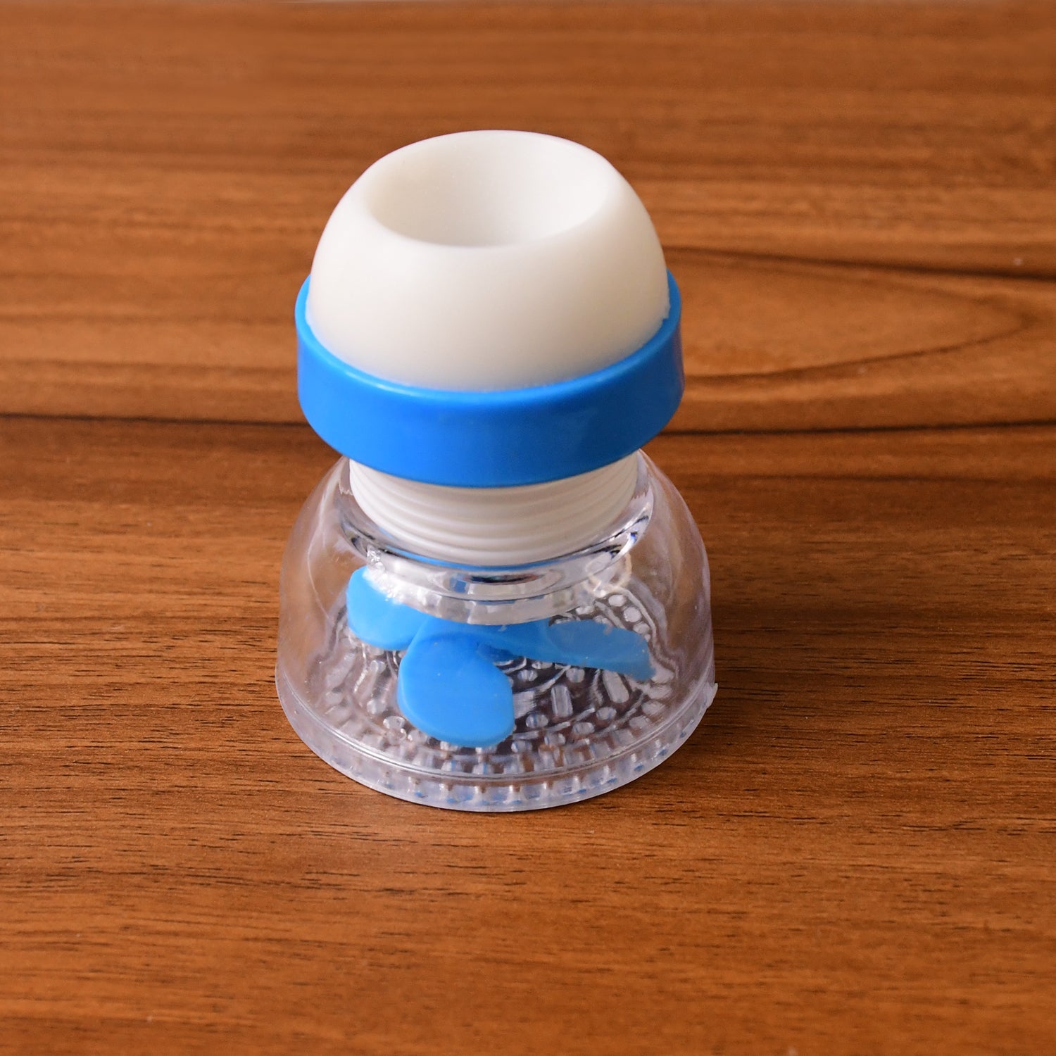 Wukusy multipurpose adjustable kitchen sink tap water filter with rotating faucet sprayer installed on a kitchen sink.