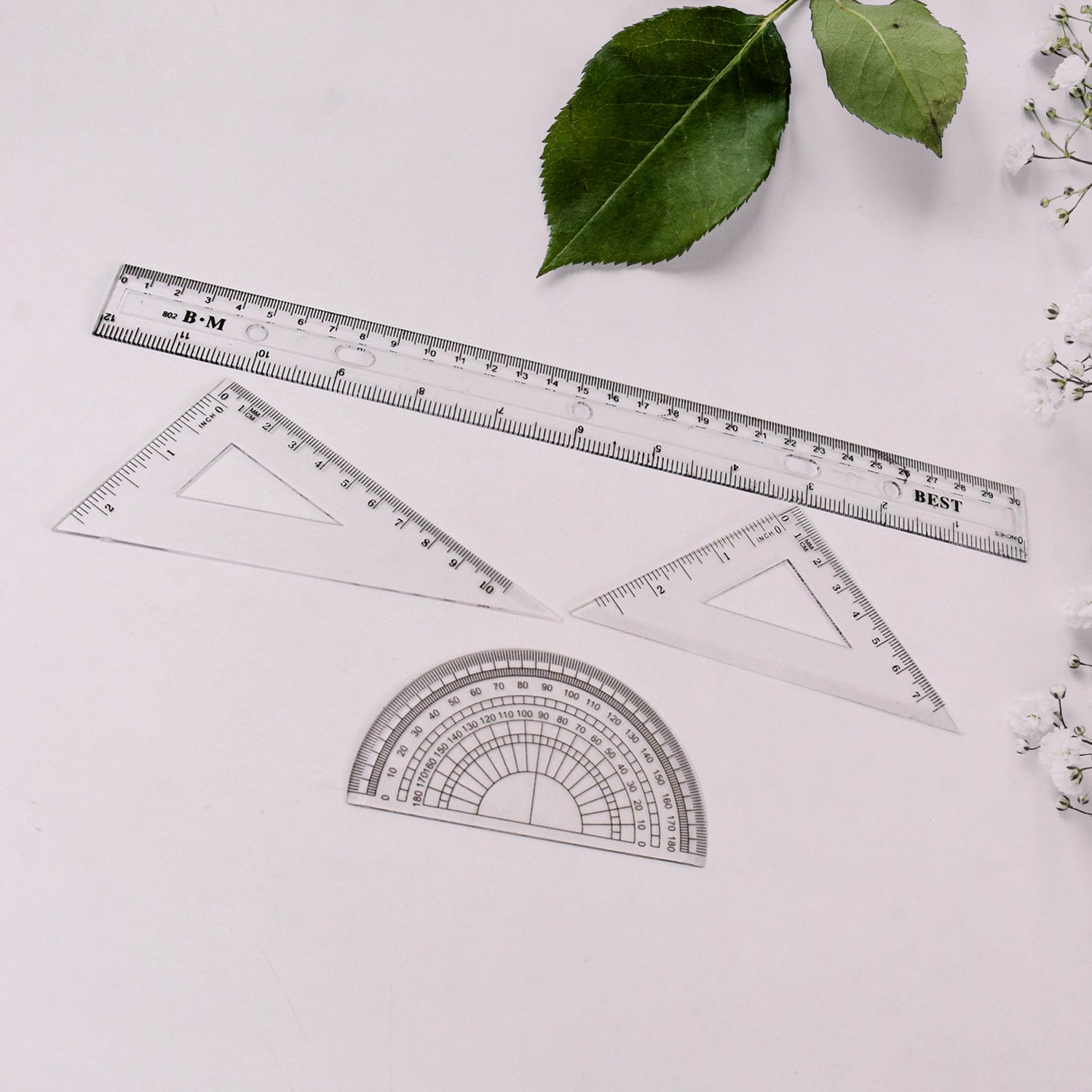 Wukusy 9-in-1 office stationery set with rulers, pens, and other school and office supplies arranged on a desk.