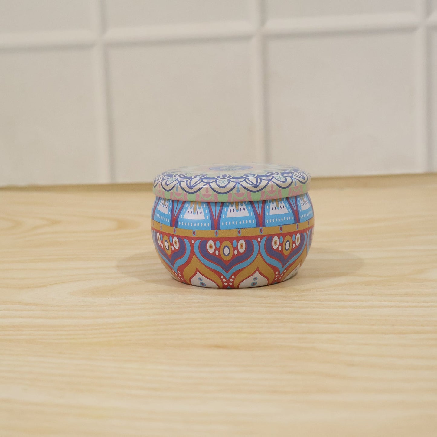 Decorative round metal mandala tin box by Wukusy, perfect for candles or trinkets, featuring intricate mandala patterns.