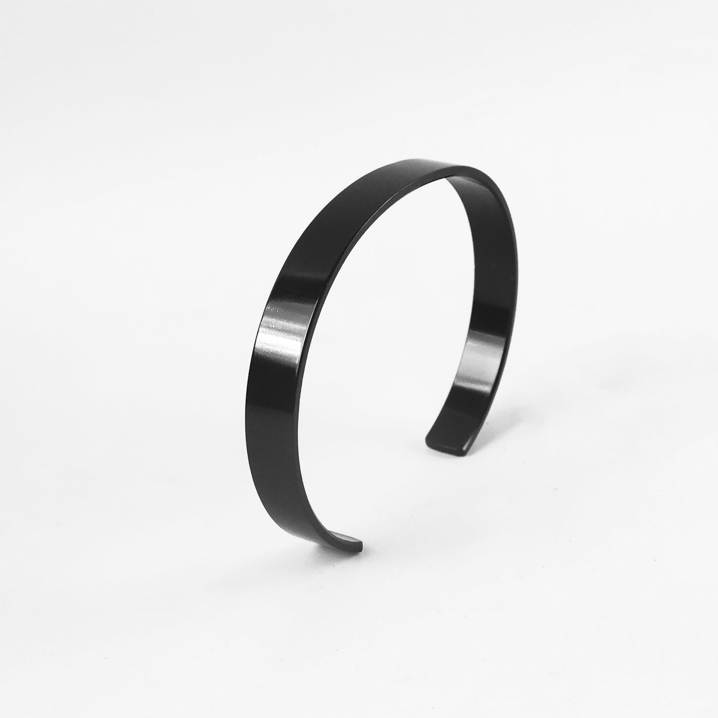 Black-plated stainless steel kada bracelet from Wukusy, featuring a sleek, stylish design for fashion wear.