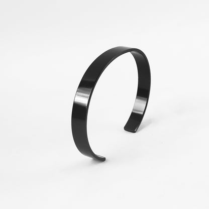 Black-plated stainless steel kada bracelet from Wukusy, featuring a sleek, stylish design for fashion wear.