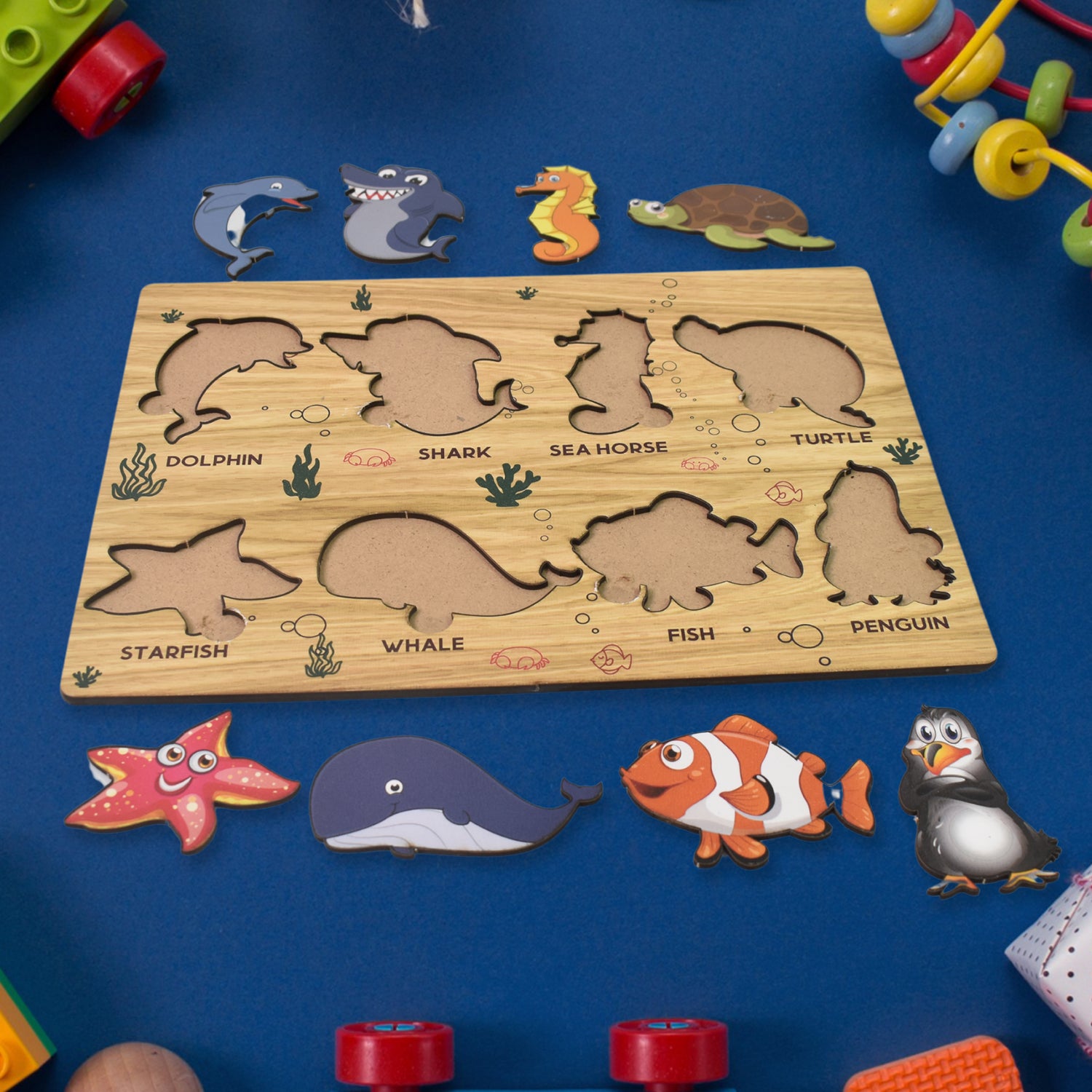 Wooden seawater animal puzzle toy by Wukusy featuring colorful animal pieces for educational learning and fine motor skills.