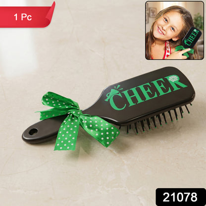 Kids printed hair brush with a cute ribbon bow handle by Wukusy, designed for gentle detangling and easy styling.
