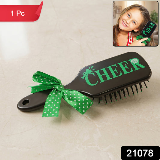 Kids printed hair brush with a cute ribbon bow handle by Wukusy, designed for gentle detangling and easy styling.