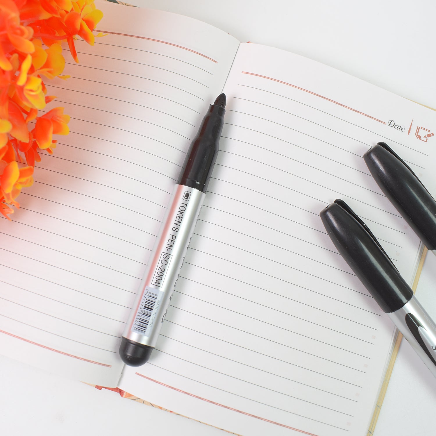 Set of four black office markers by Wukusy, suitable for school and college use, with visible caps and ink tips.
