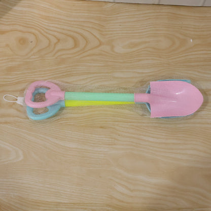 Wukusy kids beach sand shovel toy set with two plastic digging tools for sand play and outdoor fun.