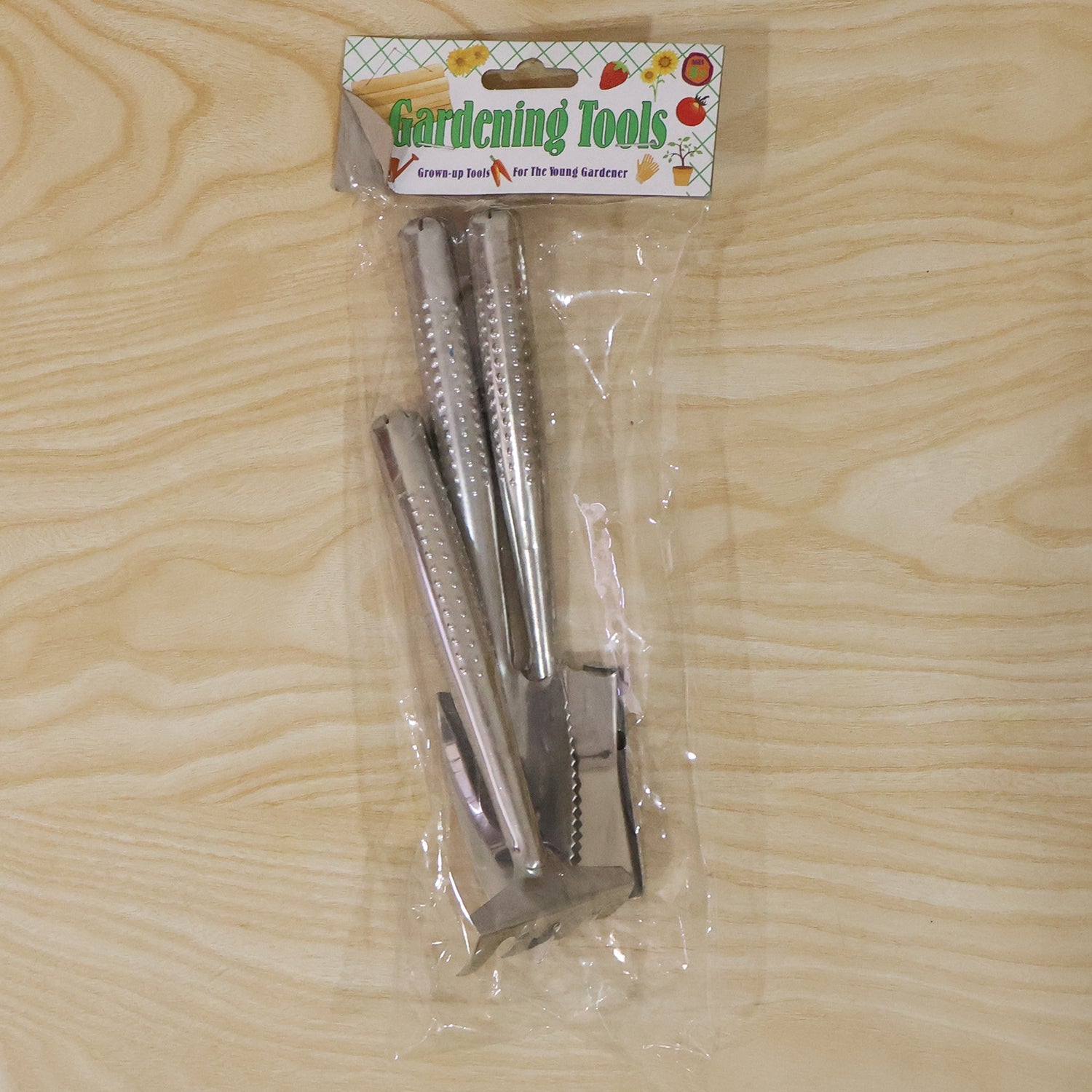 Wukusy stainless steel 3-in-1 garden hand tool set with spade, rake, and fork, displayed on a garden background.