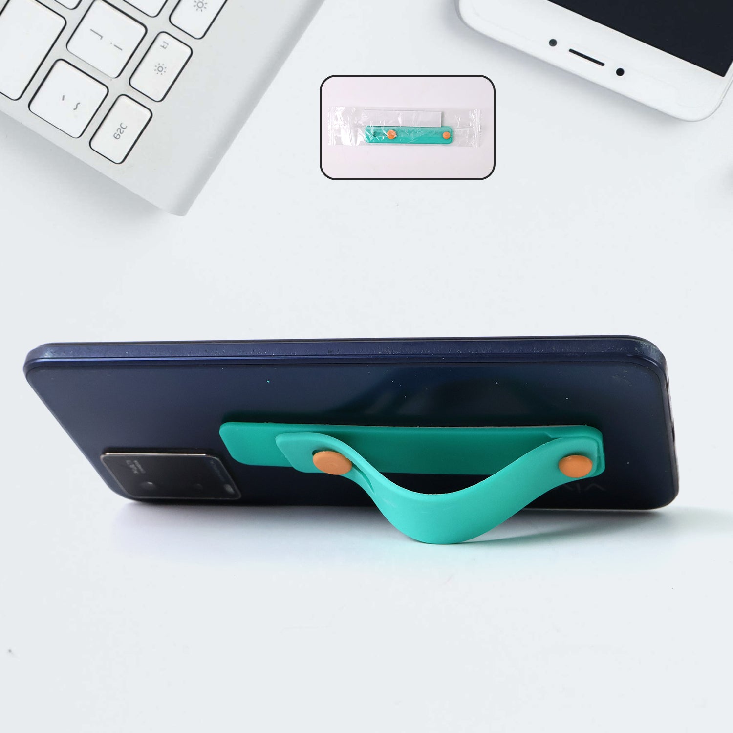 Teal green silicone phone loop finger holder grip strap with Wukusy branding, designed for secure smartphone handling.