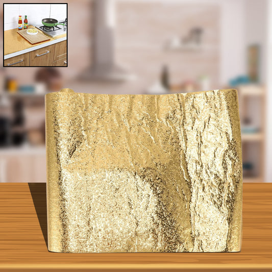 Golden waterproof self-adhesive aluminum foil wallpaper sticker for oil-proof and moisture-resistant wall or appliance surface.