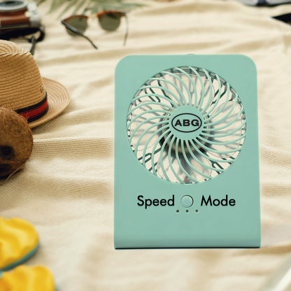Wukusy 4810 portable desk fan with three-speed settings, compact design suitable for office, school, or home use.