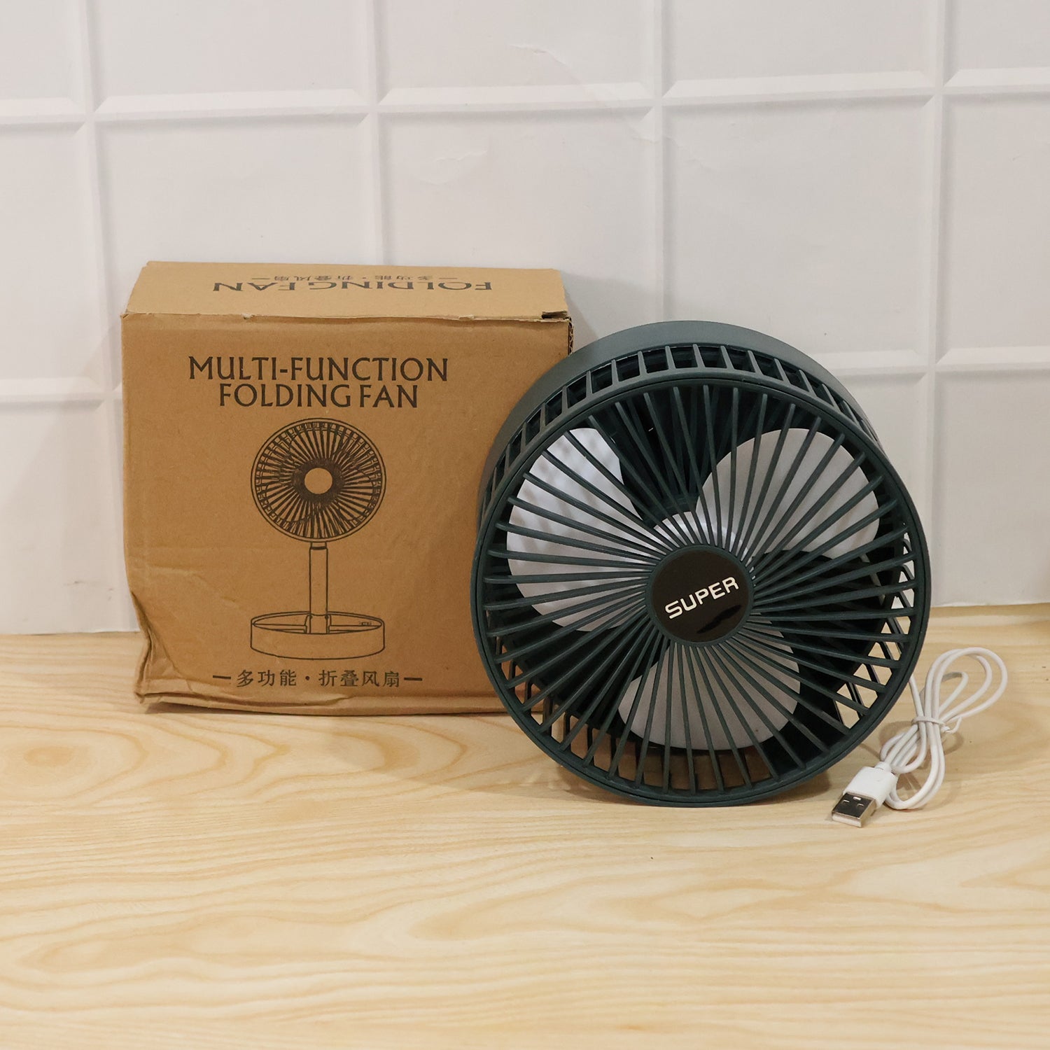 Wukusy USB portable desk fan with adjustable stand, compact cooling fan ideal for office use, shown on a desk.