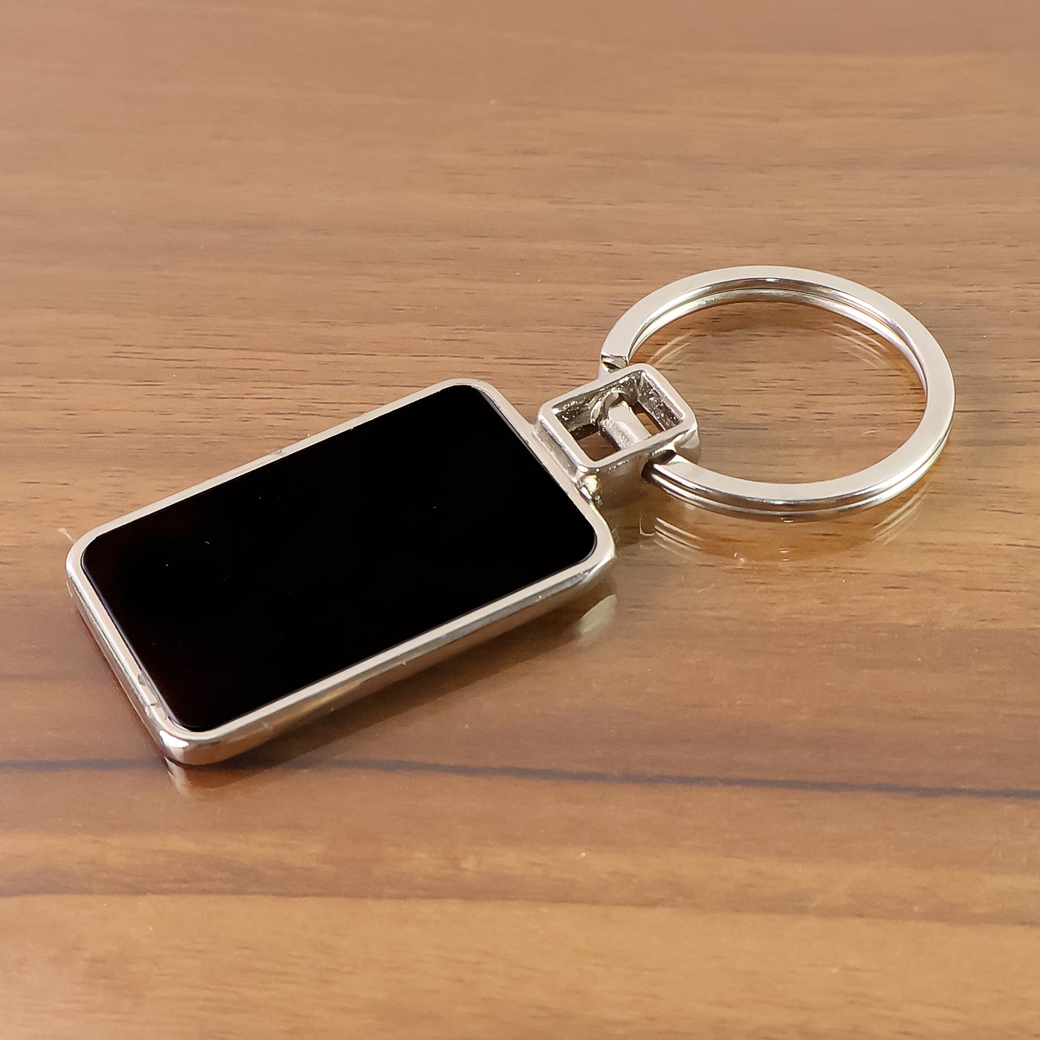 Black and silver metal keychain with rectangular design from Wukusy, featuring a sleek and durable keyring.