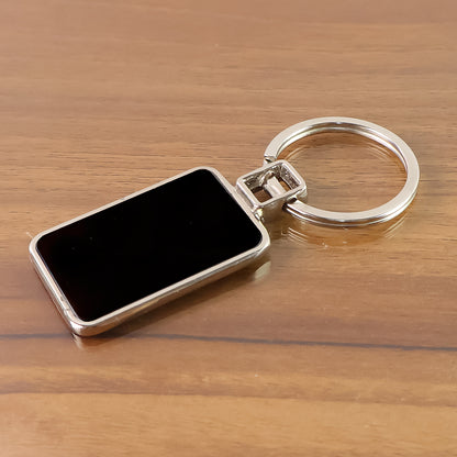 Black and silver metal keychain with rectangular design from Wukusy, featuring a sleek and durable keyring.