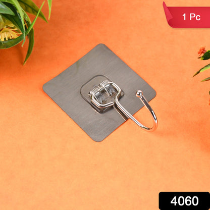 Large stainless steel self-adhesive wall hook from Wukusy, ideal for home and kitchen organization, mounted on a wall.