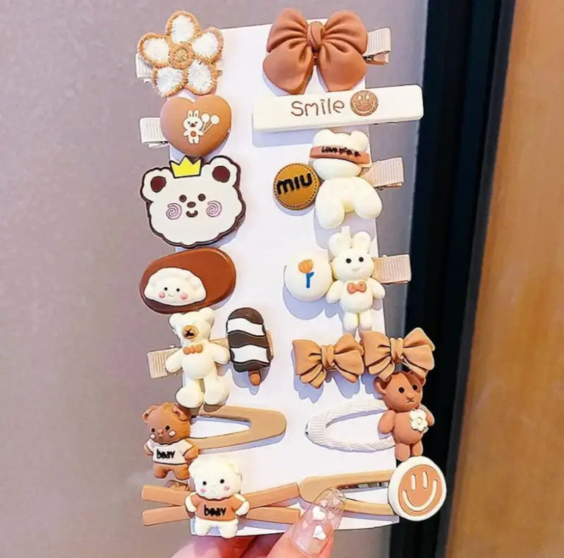 Set of 14 small multicolor Teddy Bow hair clips by Ekom, featuring rubber clips for secure, stylish hair styling.