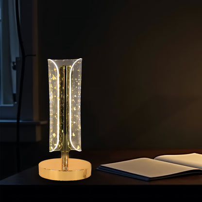 Wukusy crystal table lamp with a clear glass base and a fabric shade, illuminated to showcase its elegant design.