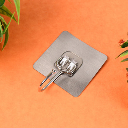 Large stainless steel self-adhesive wall hook from Wukusy, suitable for home and kitchen use, shown attached to a wall surface