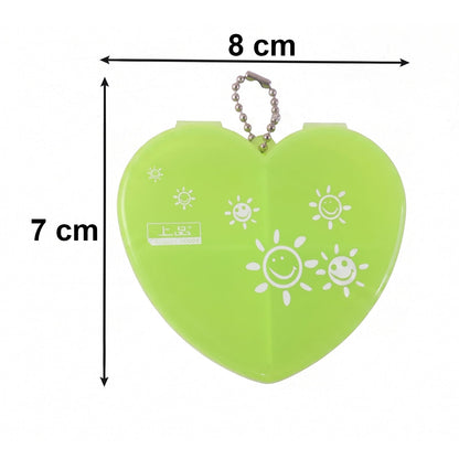 Heart-shaped plastic pill organizer box with four compartments and keychain from Wukusy, displayed open showing individual sections.