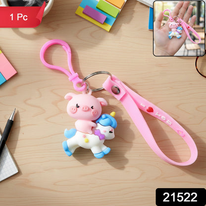 Cute pig riding a unicorn cartoon keychain by Wukusy, featuring vibrant colors and detailed animal design.