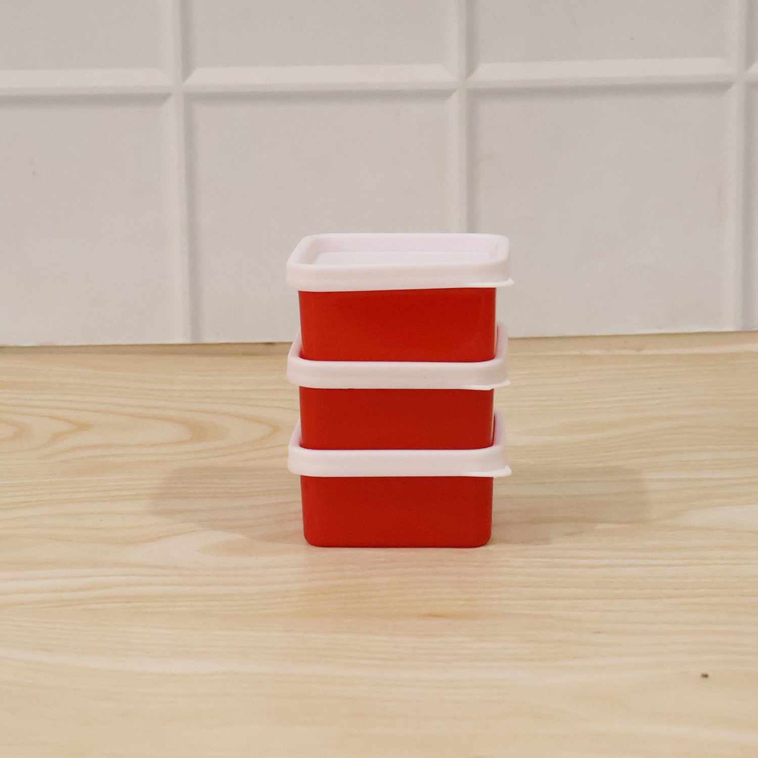 Set of three Wukusy mini plastic food storage containers with lids, ideal for small snacks and leftovers.
