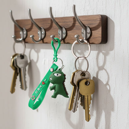 Cute dinosaur cartoon silicone keychain from Wukusy, featuring a colorful, playful dinosaur design on a keychain.