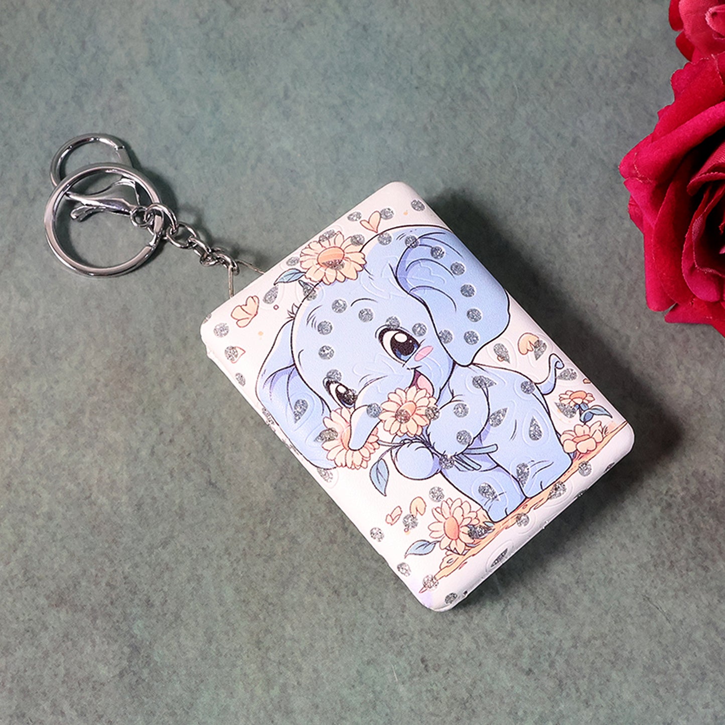 Wukusy foldable mirror keychain toy with a compact design, featuring a shiny reflective surface and colorful plastic frame.