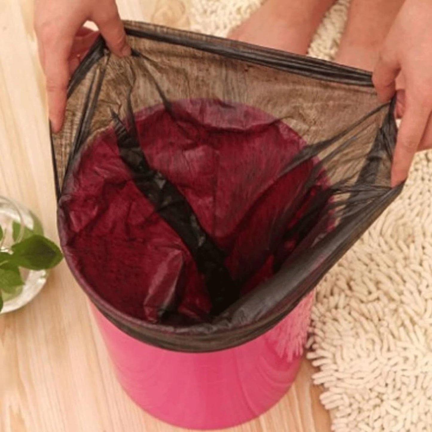 Black Wukusy garbage bag, dustbin trash bag measuring 45x50cm, shown filled with waste in a household trash bin.