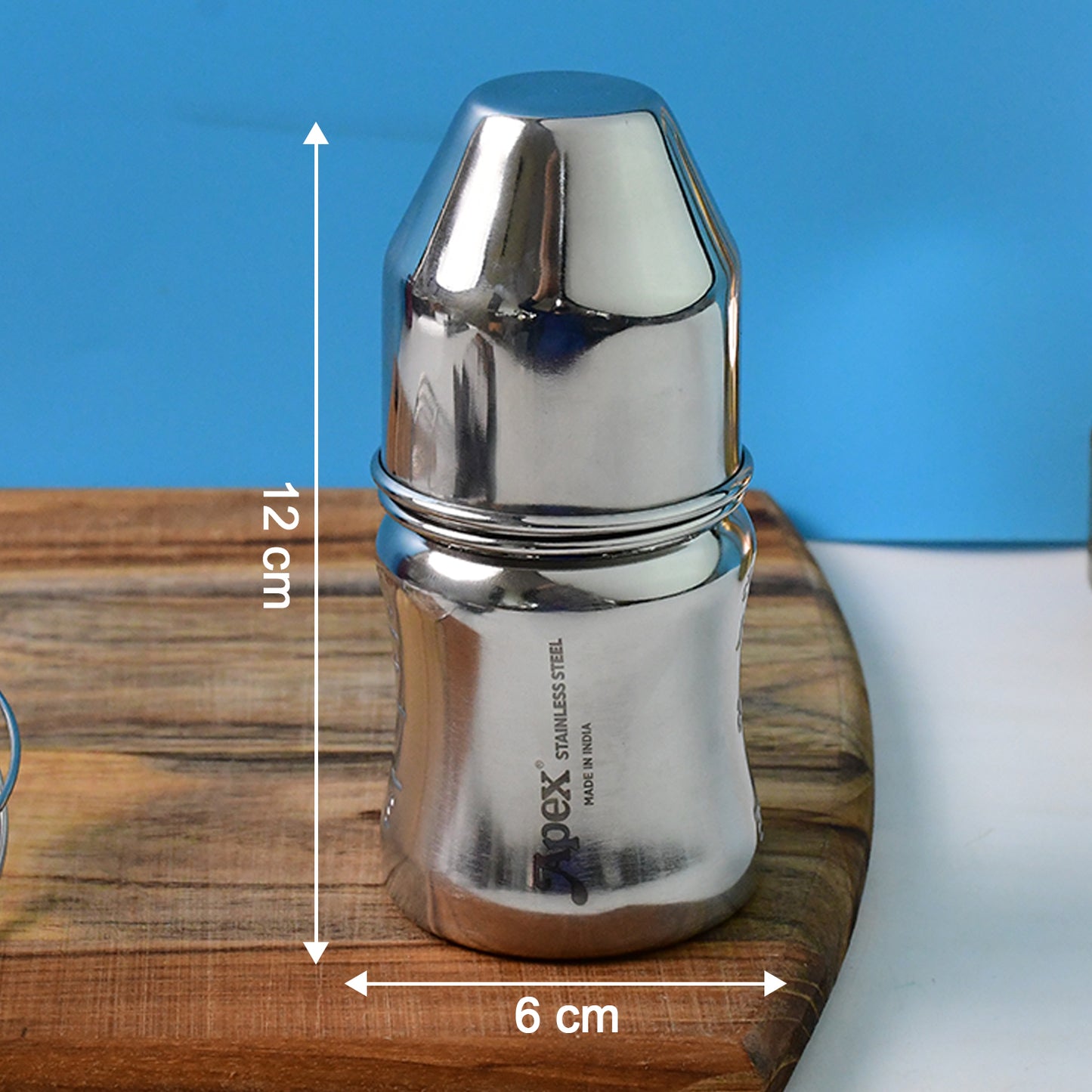 Wukusy Apex Premium Stainless Steel Baby Feeding Bottle, 125ml, with soft silicone nipple and leak-proof design, clean and ready for feeding.