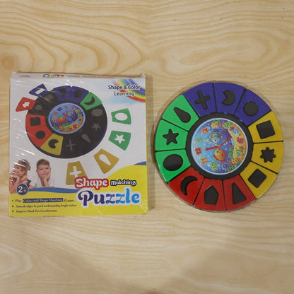 Wukusy shape and color matching puzzle toy with clock for kids and toddlers, featuring colorful interlocking pieces and clock face.