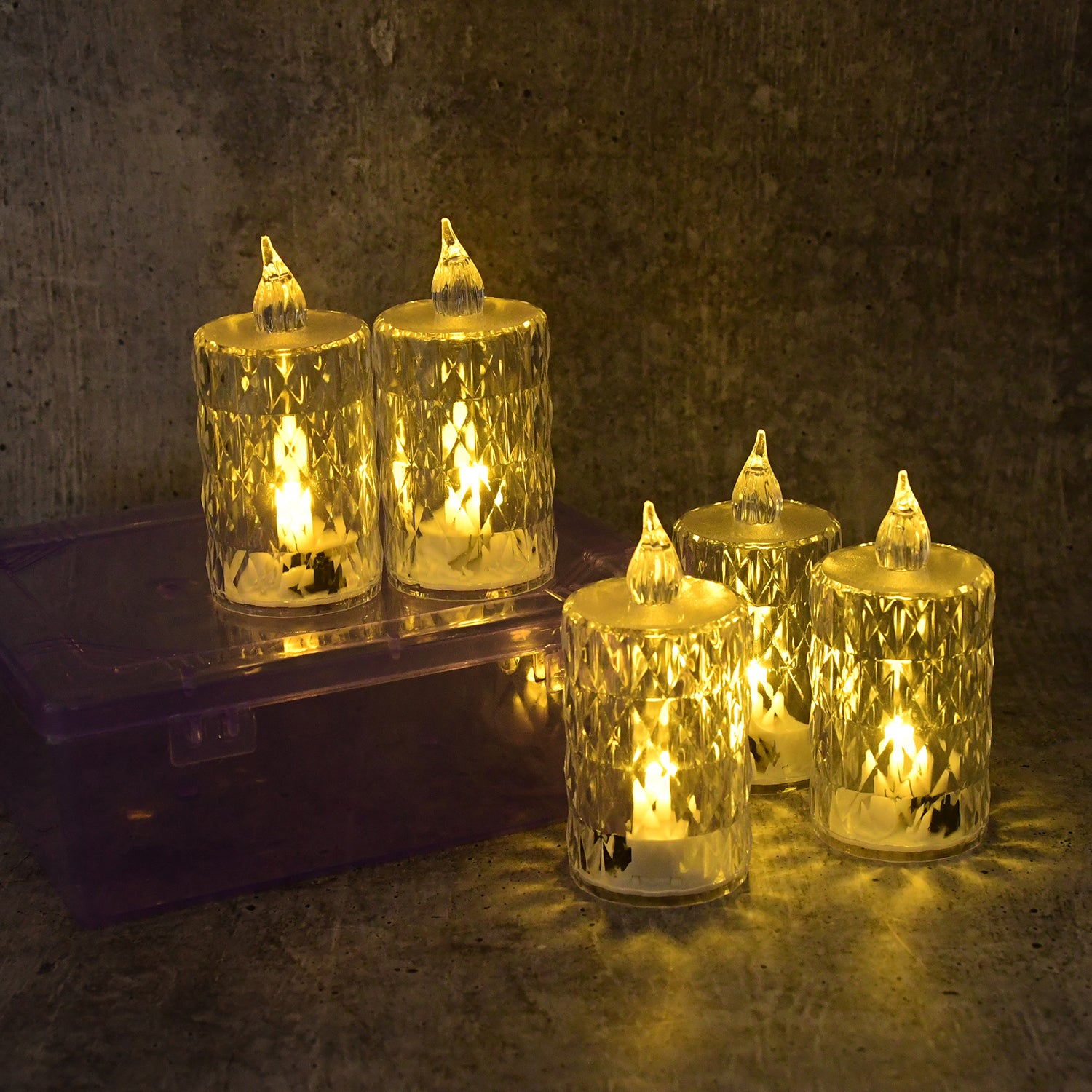 Six decorative LED crystal flameless candles from Wukusy in a home decor set, showcasing glowing crystal designs.