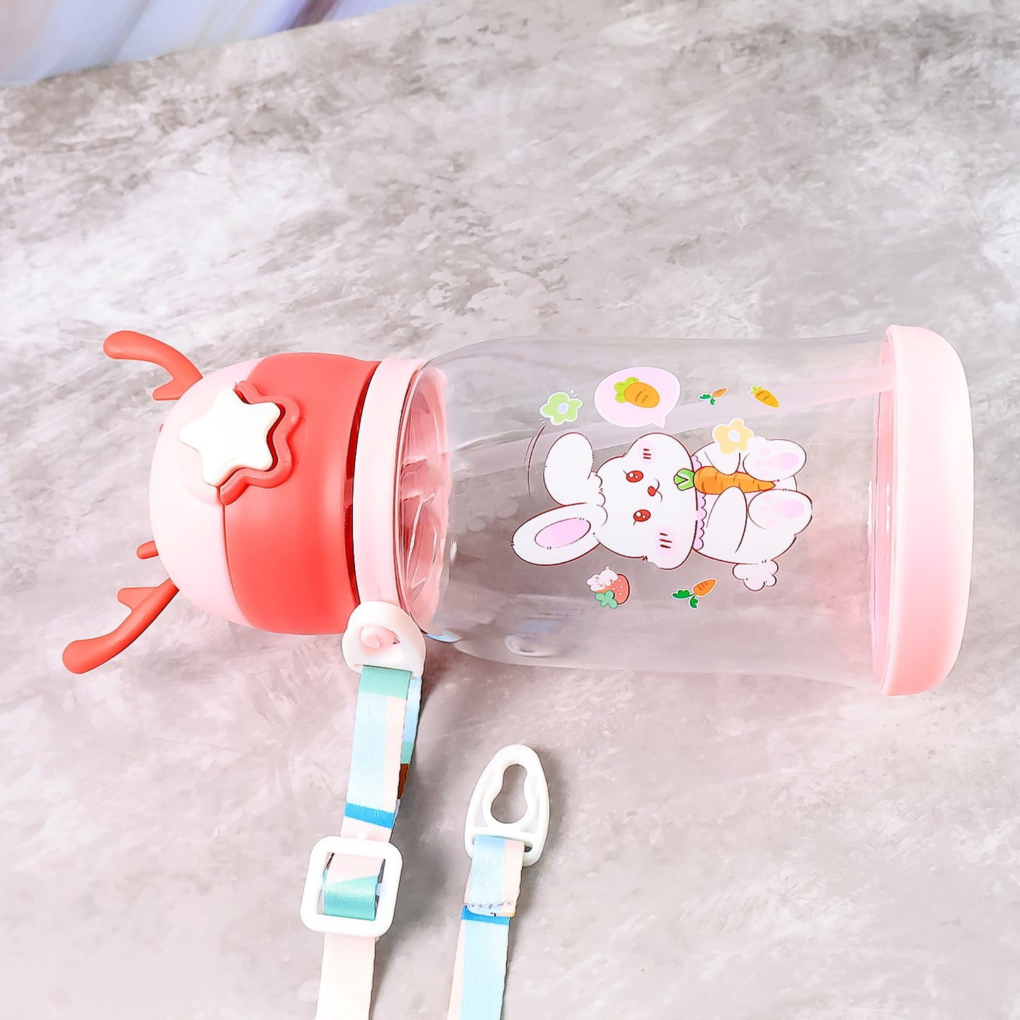 Cute cartoon water bottle by Wukusy, 450ml capacity, featuring colorful character design, ideal for kids and everyday hydration.