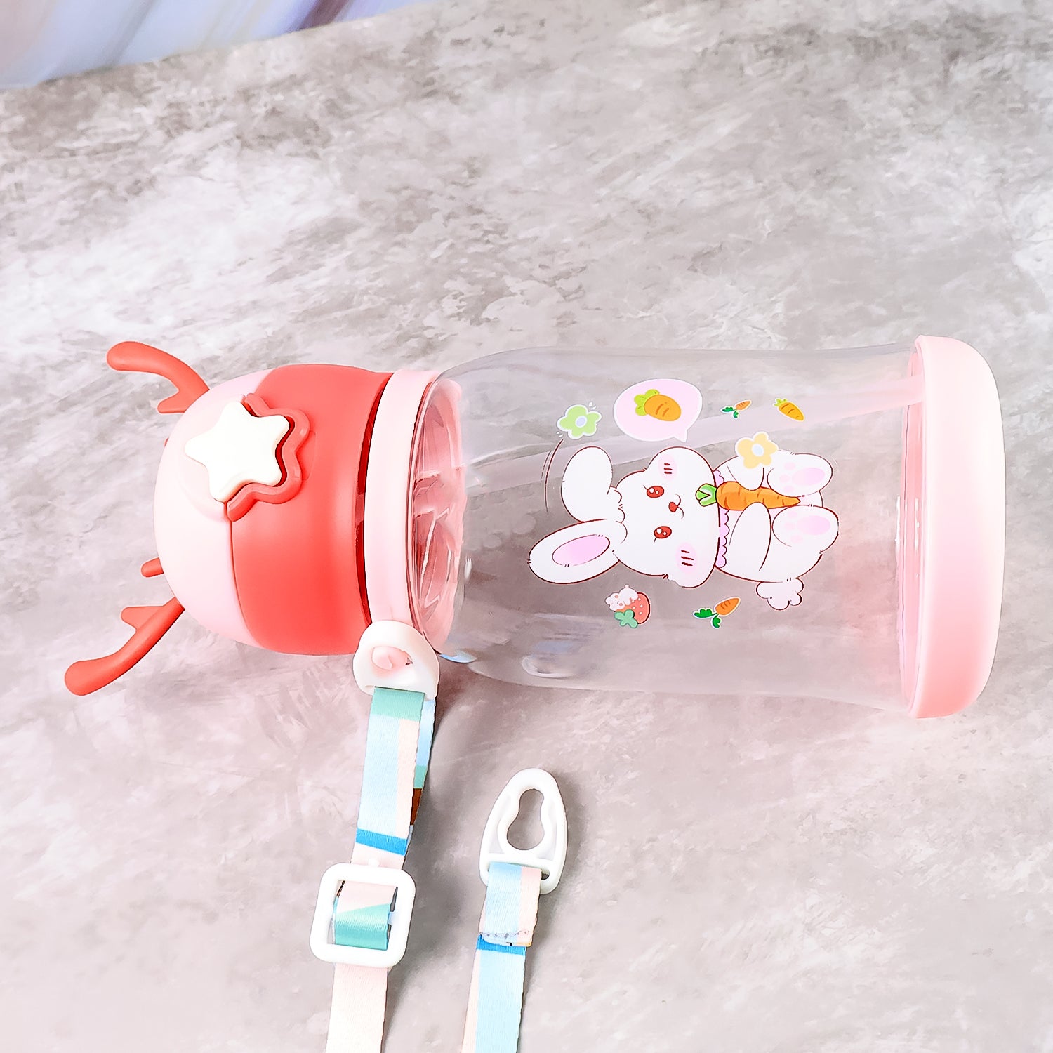Cute cartoon water bottle by Wukusy, 450ml capacity, featuring colorful character design, ideal for kids and everyday hydration.