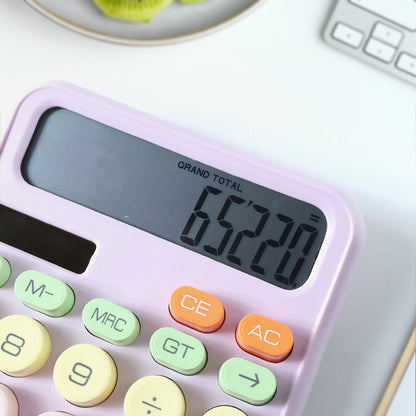 Wukusy electronic desktop calculator with numeric keypad and display showing calculation results.