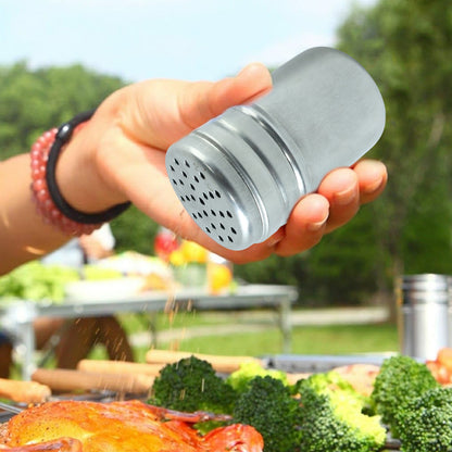 Stainless steel multipurpose spice shaker container by Wukusy, with a clear lid and compact design for kitchen use