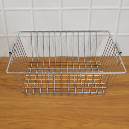 Wukusy stainless steel kitchen sink basket, 12x15 inch, used for draining and organizing utensils or produce in the sink.