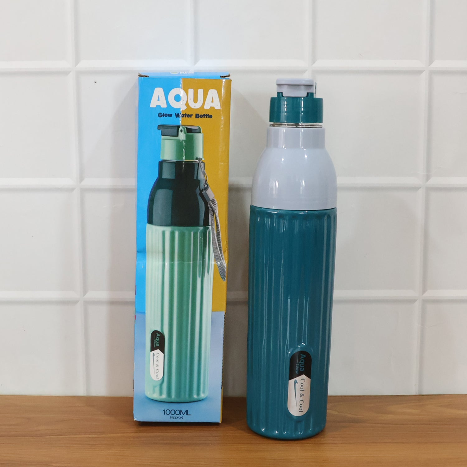 Wukusy Aqua Sports Sipper Water Bottle, 1000ml capacity, clear plastic with blue and green accents, featuring a sports sip lid.