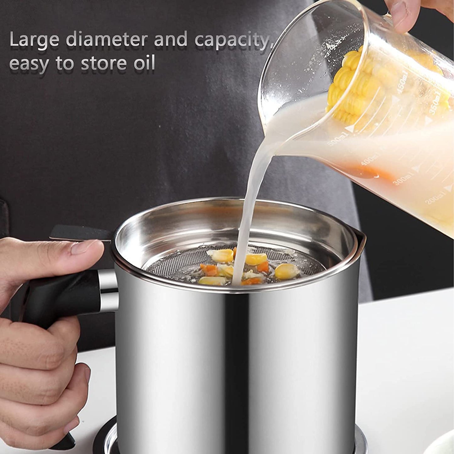 Wukusy stainless steel oil strainer pot with lid and filter mesh for filtering cooking oil and food residues.