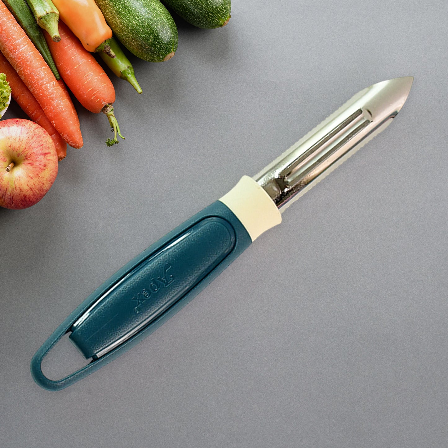 Wukusy Apex stainless steel potato peeler with ergonomic handle and sharp blade for efficient peeling in close-up image.