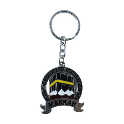Wukusy premium Makkah design metal keychain with round pendant showing intricate Islamic patterns and branding details.