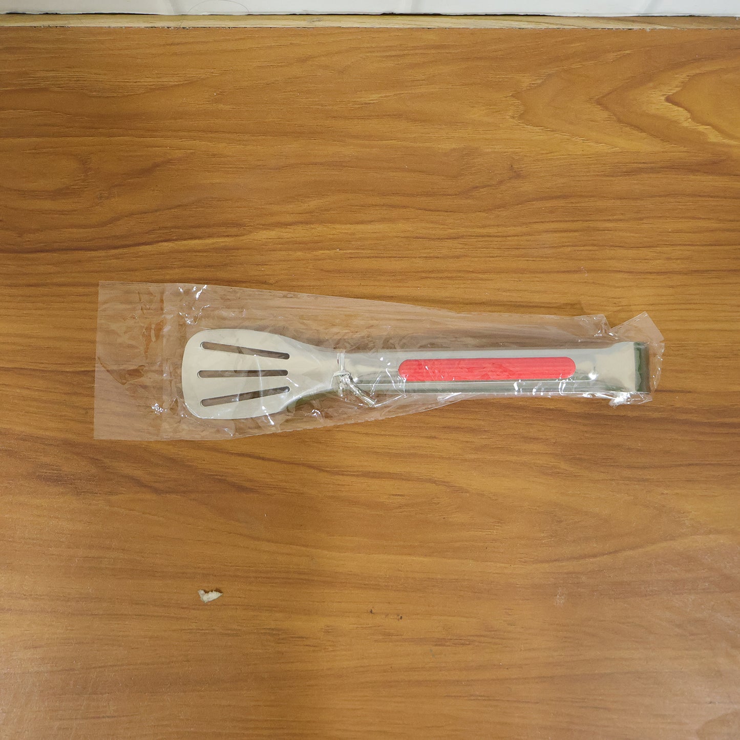 Wukusy stainless steel multi-purpose kitchen tongs with anti-slip grip, suitable for cooking and serving food.