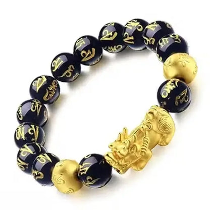 Ekom black and gold lucky bracelet with Pixiu charm, designed for health and good fortune, featuring intricate details.