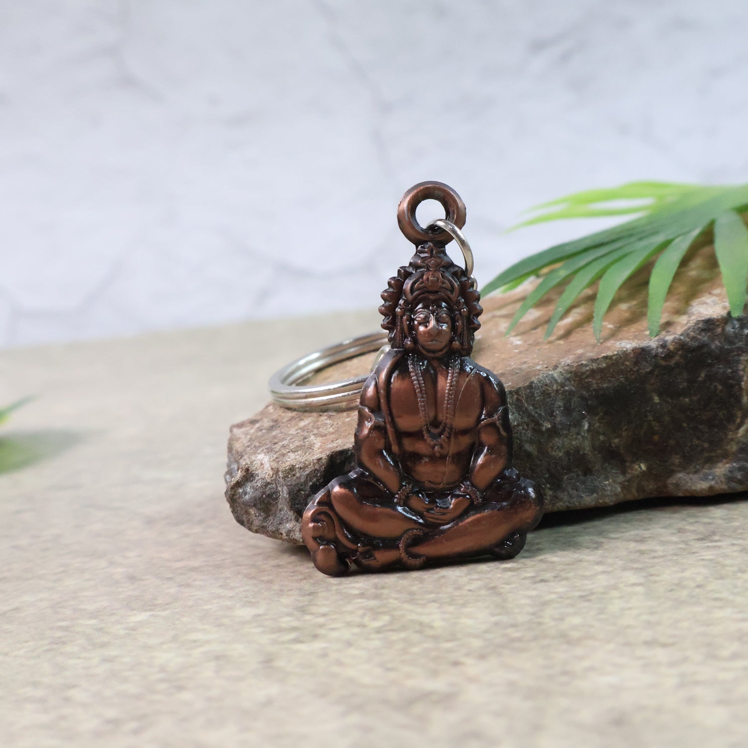 Wukusy Lord Hanuman sitting pose keychain with detailed craftsmanship, featuring Hanuman seated in a traditional pose.