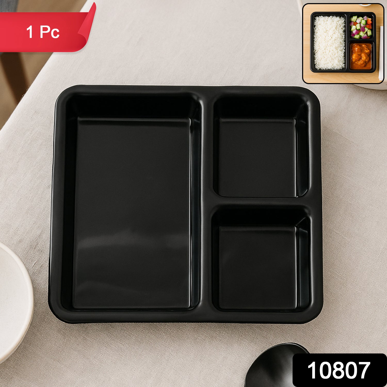 Black plastic multi-compartment meal serving tray with three sections, ideal for dining and meal presentation.