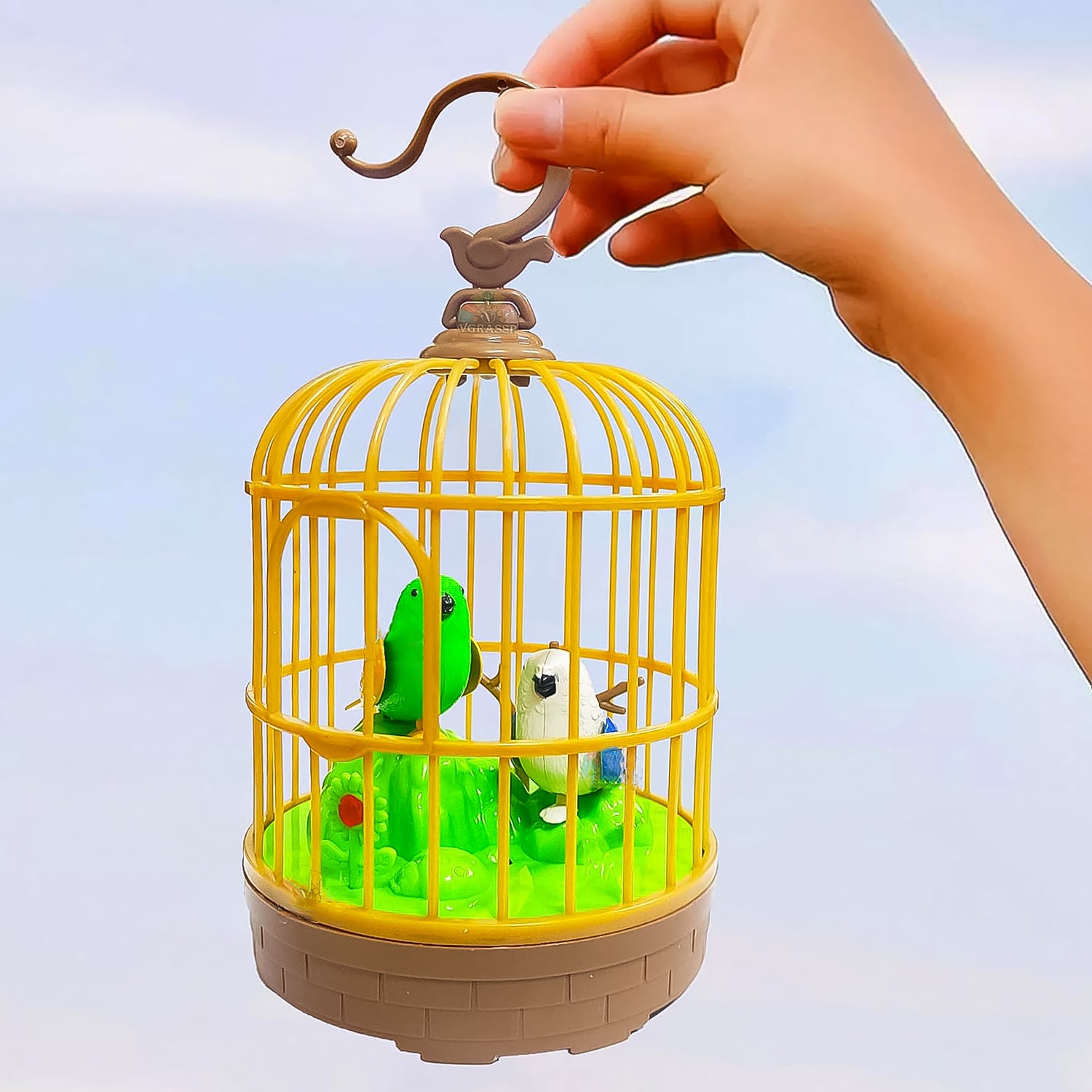 Wukusy sound-activated chirping bird toy in hanging cage, colorful pinjra design, battery not included, for bird enrichment and play.