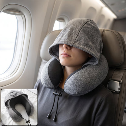 Grey U-shaped hooded travel pillow with drawstring hood and neck support, designed for comfortable rest during travel.