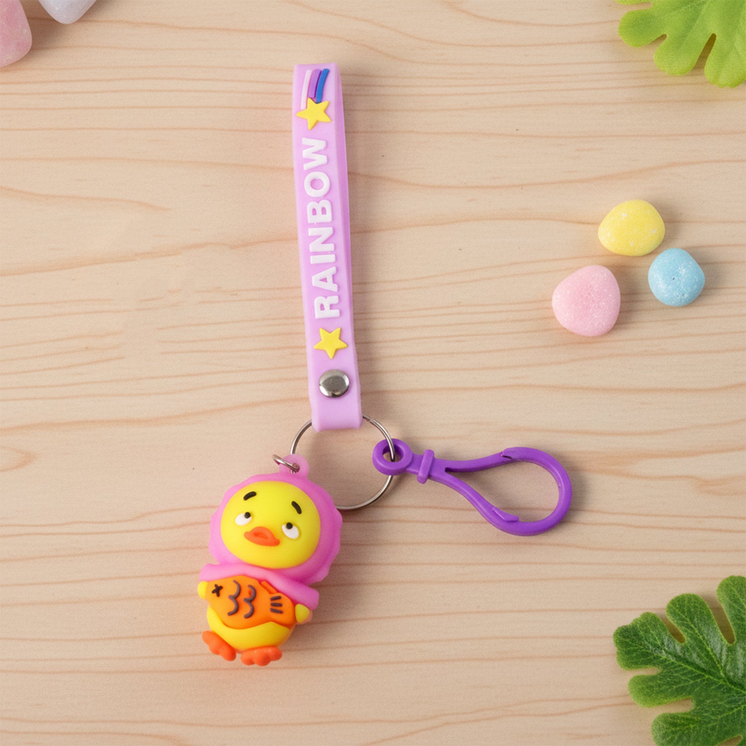 Cute cartoon duck keychain from Wukusy featuring a small, colorful duck with a loop for keys or bags.