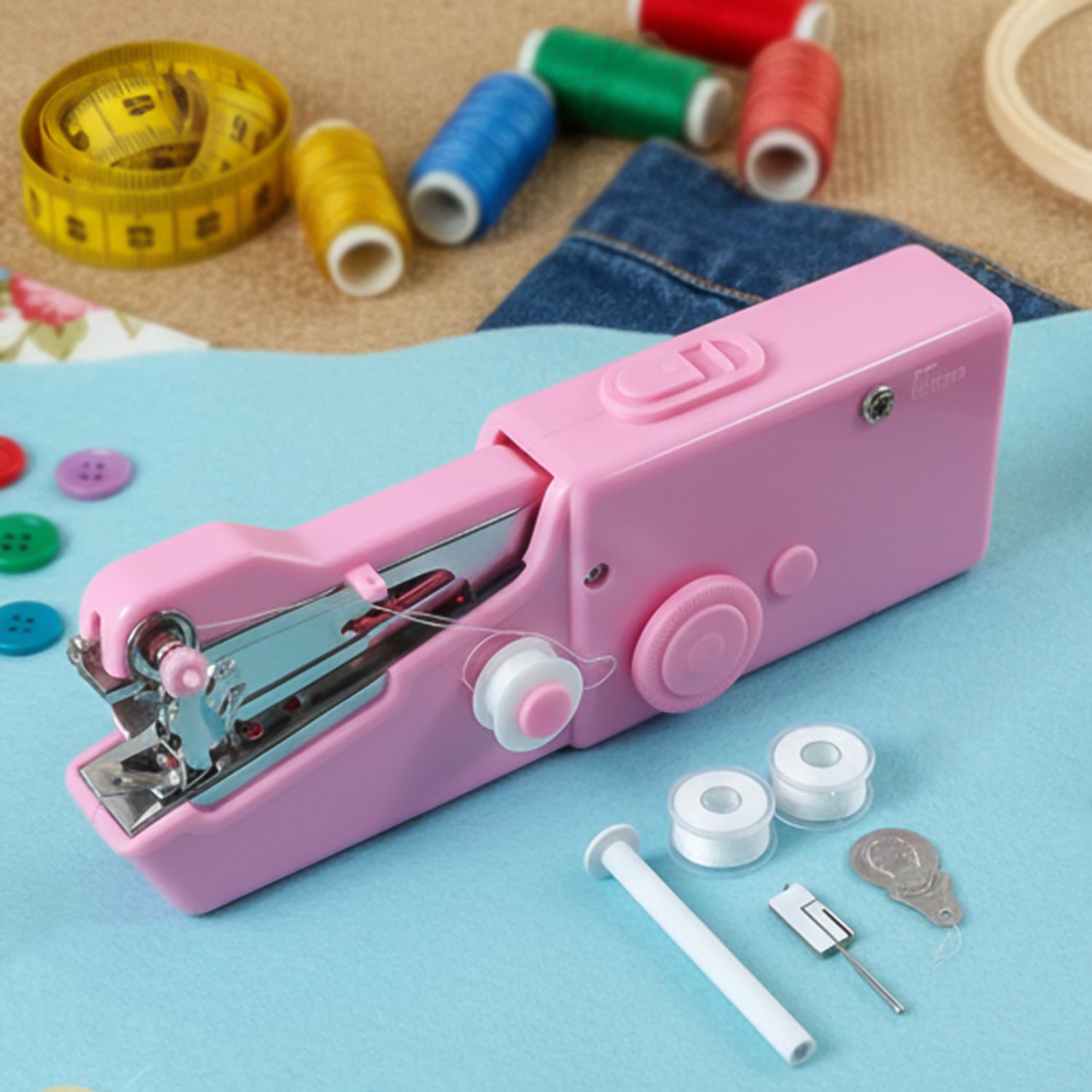 Portable Wukusy handheld sewing machine set with compact design, featuring a black and silver body and foot pedal for easy sewing.