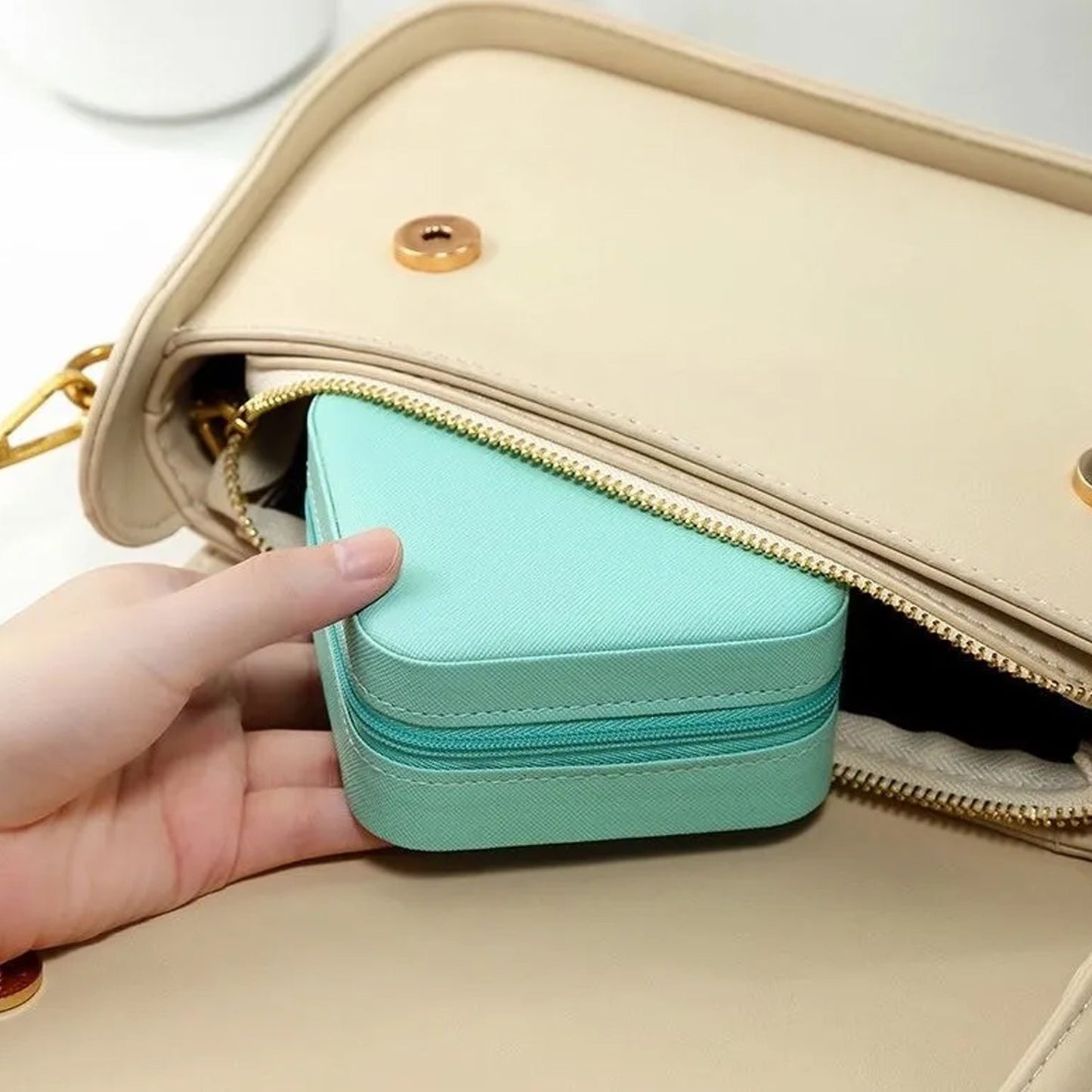 Wukusy mini portable jewelry box for women with leather exterior, featuring compartments for rings, earrings, necklaces, and pendants.